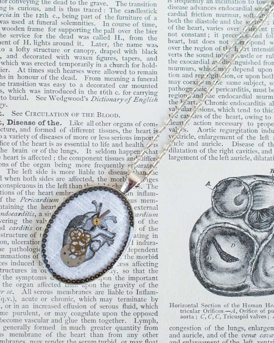 steampunk necklace featuring authentic watch parts and a photo of an anatomical heart