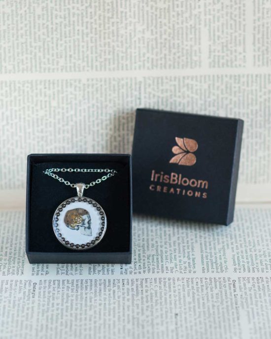 Steampunk necklace with an anatomical skull and vintage watch parts with jewellery box