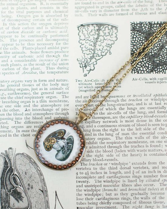 steampunk necklace featuring an anatomical photo of lungs and vintage watch parts