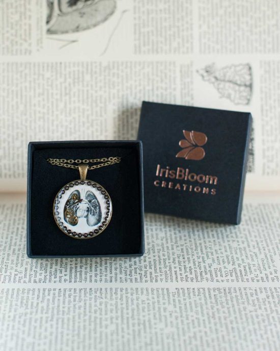 steampunk necklace featuring an anatomical photo of lungs and vintage watch parts with jewellery box