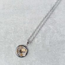 Round steampunk necklace made with watch parts