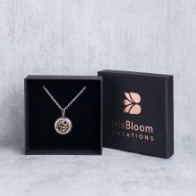 Handcrafted Mechanicalist steampunk necklace presented in a branded, eco-friendly jewelry box