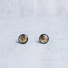Black steampunk stud earrings with real watch gears set in resin.