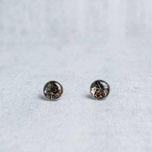 Silver steampunk stud earrings with layered mechanical components.