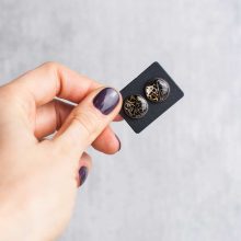 Silver steampunk stud earrings made from authentic watch parts.