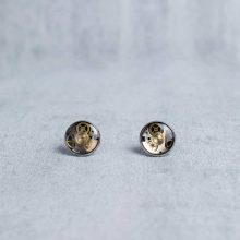 Handmade silver steampunk earrings with mechanical watch parts.