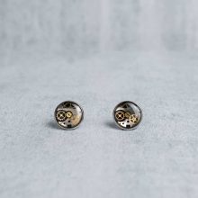 Handmade silver steampunk earrings with mechanical watch parts.