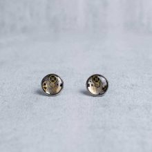 Handmade silver steampunk earrings with mechanical watch parts.