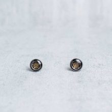 Silver steampunk stud earrings with layered mechanical components.