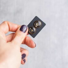 Resin-coated gold steampunk earrings with detailed gears
