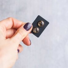 Handmade steampunk earrings with various vintage watch parts