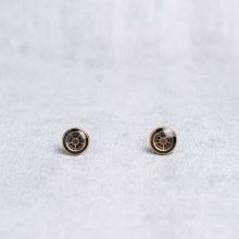 Handmade gold studs with tiny mechanical watch parts