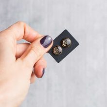 Handmade gold studs with tiny mechanical watch parts