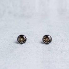 Silver steampunk stud earrings with small watch gears.