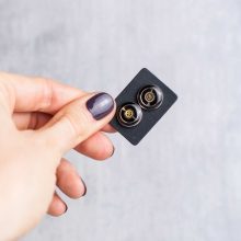 Silver industrial steampunk earrings with compact mechanical elements.