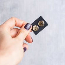 Silver steampunk stud earrings made from authentic watch parts.