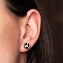 Handmade steampunk earrings worn on ear